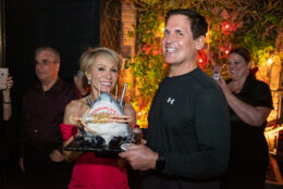 Barbara Corcoran and Mark Cuban with shark-shaped birthday cake