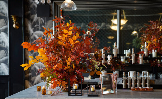 Bar decor with red and yellow fall leaves