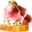 Crostini with prosciutto and goat cheese sprinkled with finely diced chives